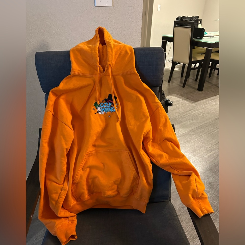 Orange Magician Golf Wang Hoodie with embroidered graphic